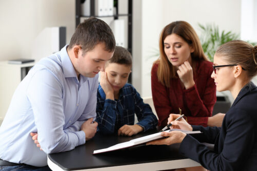 family law attorney meeting with co-parents and child